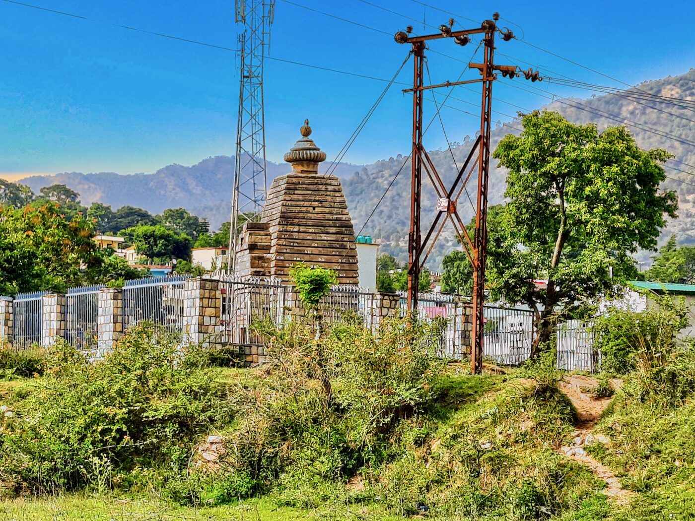 A weathered Katyuri-era stone temple — the artistic signature of early medieval Kumaon